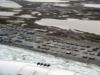 Hall Beach Airport - Abeam the airport from overhead the community of Hall Beach. - by Tim Kalushka