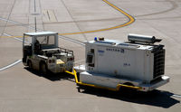 George Bush Intercontinental/houston Airport (IAH) - Tug pulling generator - by Ronald Barker