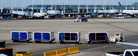 Chicago O'hare International Airport (ORD) - Baggage cart train at O'Hare - by Ronald Barker