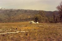 Gravelly Valley Airport (1Q5) - N39932 at Lake Pillsbury in 1991. View is to the north and down the runway. Most pilots take off in the opposite direction toward the lake to avoid the higher terrain. Notice driftwood near 932 which is from high water. - by S B J