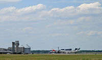Dover Afb Airport (DOV) - The ramp of Dover Air Force Base, as seen from the southeast corner (at the Air Mobility Command Museum).  A civilian Evergreen Boeing 747 is on a military charter. - by Daniel L. Berek