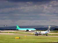 Manchester Airport, Manchester, England United Kingdom (EGCC) - Busy scene at Manchester EGCC with storm looming in the background. - by Clive Pattle