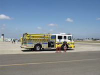 Camarillo Airport (CMA) - Ventura County Fire Department Vehicle based at CMA Fire Station. CMA Aircraft Control Tower at extreme left. - by Doug Robertson