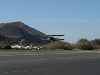 Santa Paula Airport (SZP) - N65124 Boeing Stearman with upgraded P&W R985 Wasp Jr. by Jacobs-450 Hp, making high speed low pass at 22L banner tow array for successful advertising banner tow pickup. Please watch complete sequence here. - by Doug Robertson