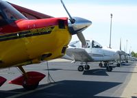 Reid-hillview Of Santa Clara County Airport (RHV) - A long line of props along transient parking at Reid Hillview Airport, CA.  - by Chris Leipelt
