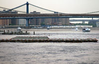 Downtown Manhattan/wall St Heliport (JRB) - This view is from just off the southern tip of Manhattan Island, with a nice East River cityscape for a backdrop. - by Daniel L. Berek