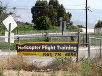 Santa Paula Airport (SZP) - Helicopter Flight Training advertising, near Rwy 22 threshold area just off-airport - by Doug Robertson
