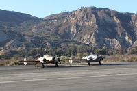 Santa Paula Airport (SZP) - A couple of twin Beech 18 variants. N5644D an E18S based at SZP & N15KK, a US Army Air Corps AT-11 bombing practice trainer side by side near SZP Helipad. Unusual to see two twin Beech 18 variants together here. See N15KK photos. - by Doug Robertson