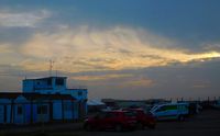 Swansea Airport - Sundown over the airport buildings - by Roger Winser