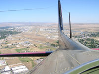 Boise Air Terminal/gowen Fld Airport (BOI) - Looking back at runways 10R & 10L from the radio compartment of a B-17. We have just taken off from RWY 28R. - by Gerald Howard