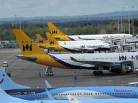Manchester Airport, Manchester, England United Kingdom (EGCC) - MON/TOM aircraft on there stands/gates on T2  - by andysantini