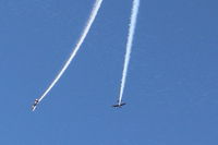 Santa Paula Airport (SZP) - N144X and N145HR doing a high near-synonymus razzle-dazzle smoke high overhead arrival before landing successively from the Rwy 22 pattern  - by Doug Robertson