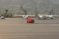 Santa Paula Airport (SZP) - Typical Fire Suppression load-drop bucket left on the duty runway from a FireFighter helicopter-at the Thomas FireBase - by Doug Robertson