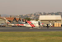 Santa Paula Airport (SZP) - N496DF 1969 Bell EH-1H IROQUOIS, (CAL-FIRE 902) Government USDA FOREST SERVICE, boarding for another sortie, Thomas Fire, at SZP FireBase. Note smoky sky. - by Doug Robertson