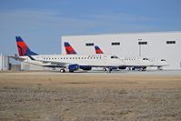 Boise Air Terminal/gowen Fld Airport (BOI) - Aircraft awaiting maintenance on the new ramp for the Skywest maintenance hangar. - by Gerald Howard