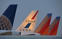 Boise Air Terminal/gowen Fld Airport (BOI) - Early morning line up on the south side of Concourse B. - by Gerald Howard