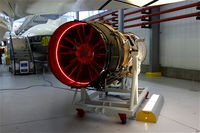 Duxford Airport, Cambridge, England United Kingdom (EGSU) - Rolls Royce Olympus engine under the wing of a Concorde, at IWM Duxford. - by Graham Reeve