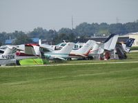 Fond Du Lac County Airport (FLD) - busy pre EAA 18 - by magnaman