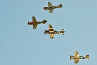 Manchester Airport - P-40s and P-47s fly by at Nampa Air Show. - by Gerald Howard
