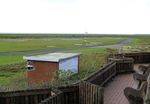 Norderney Airport, Norderney Germany (EDWY) - looking west from the restaurant towards taxiway and runway at Norderney airfield - by Ingo Warnecke