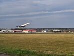 Aberdeen Airport - ABZ runway and Offshore helicopter base in the background - by FerryPNL
